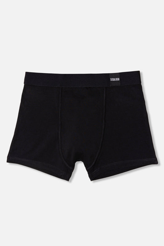 Black packing boxer briefs on a light gray background