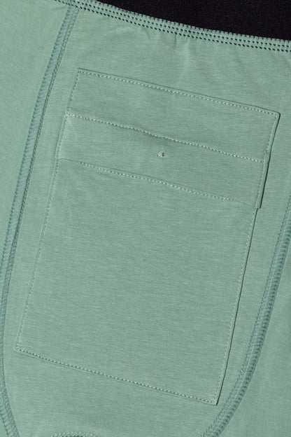 Close-up of discreet inside pocket in the green packing boxers