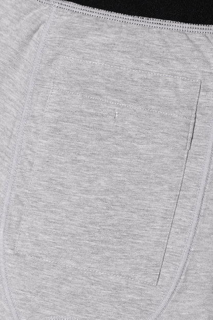 Close-up of the discreet grey fabric pocket detail