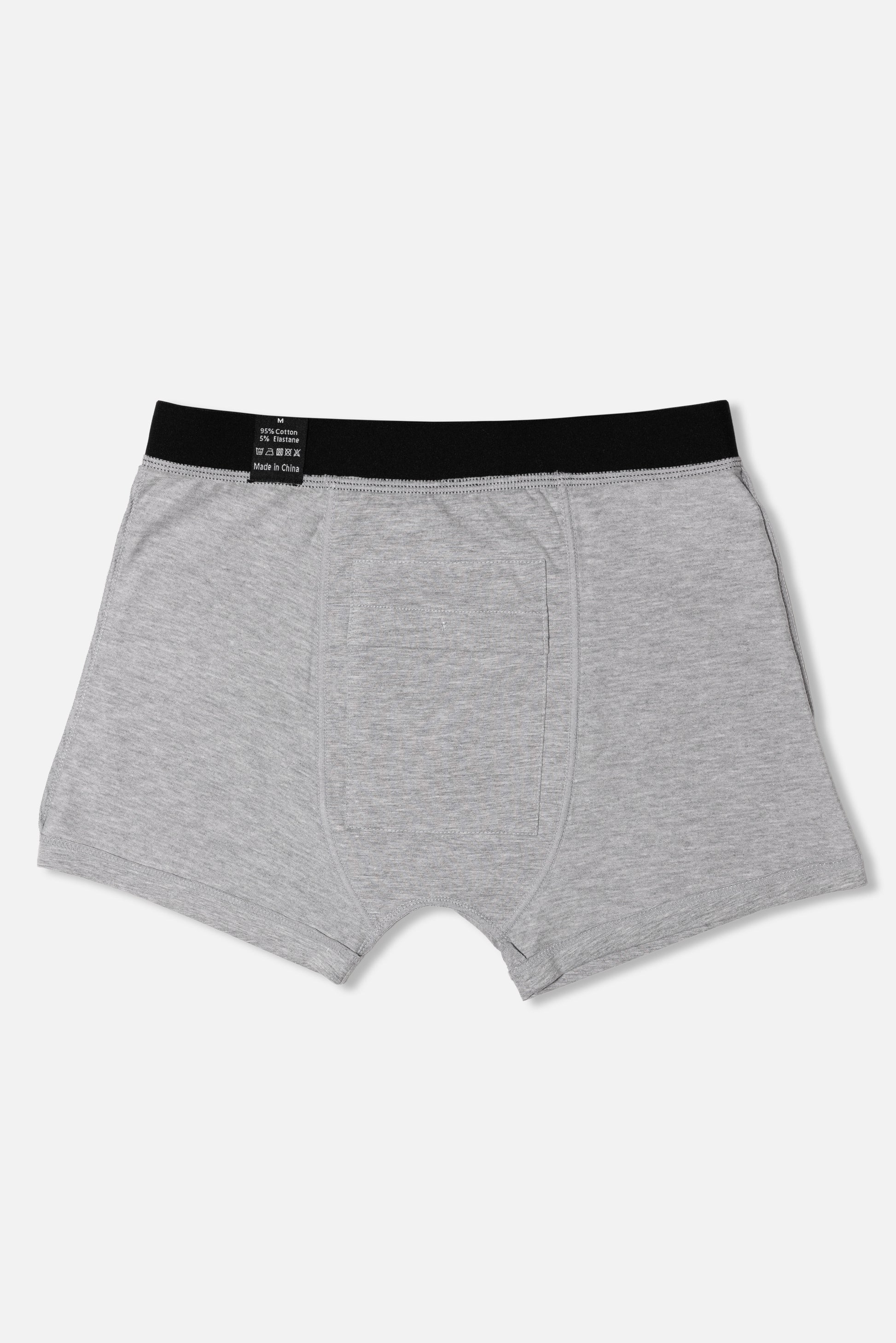 Inside of grey packing boxer briefs with black waistband on a white background