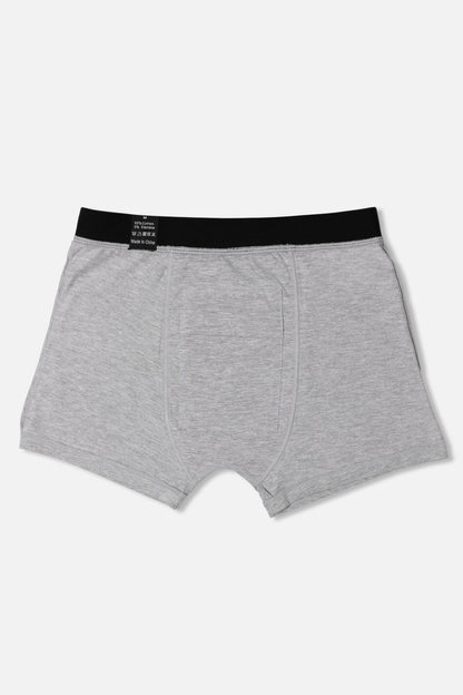 Inside of grey packing boxer briefs with black waistband on a white background