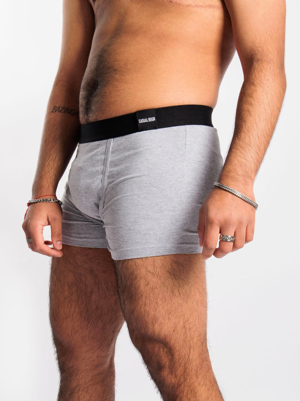 Model wearing size M grey packing boxers and soft-form packer.